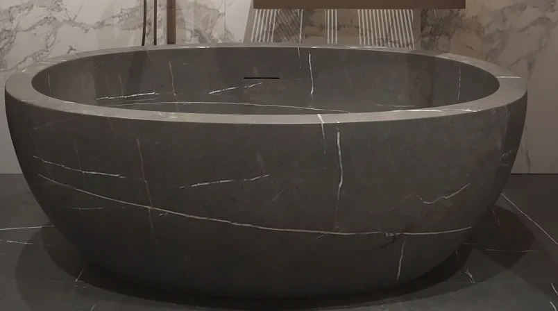 freestanding honed Nero Margiua oval marble stone bathtub