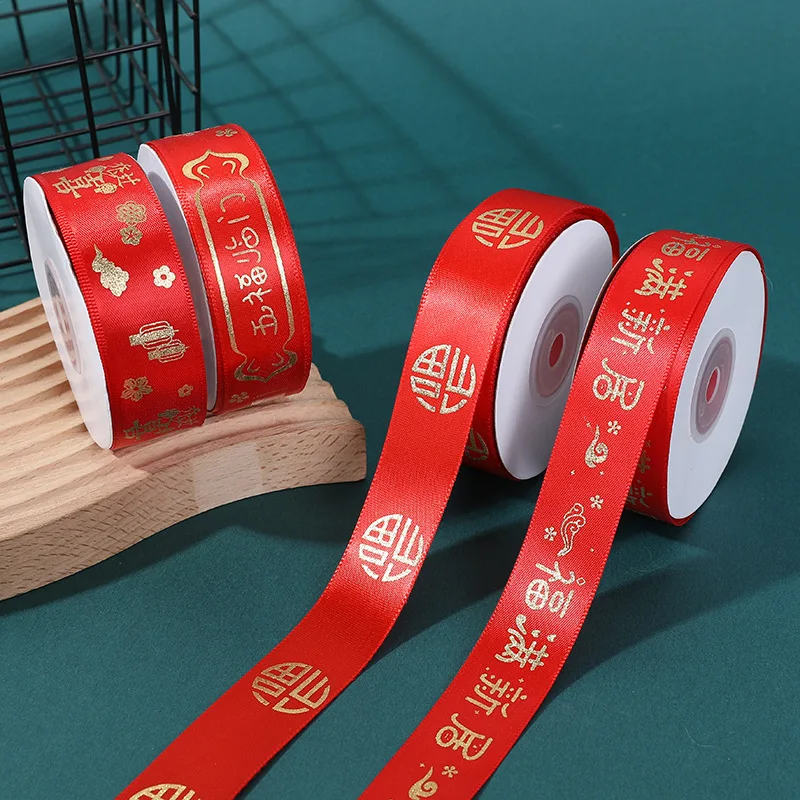Wholesale 2.5cm Satin Red Ribbon Bow Pattern Rich Word Bronzing Home Housewarming Wedding Festive Occasions Roll Silk Ribbon