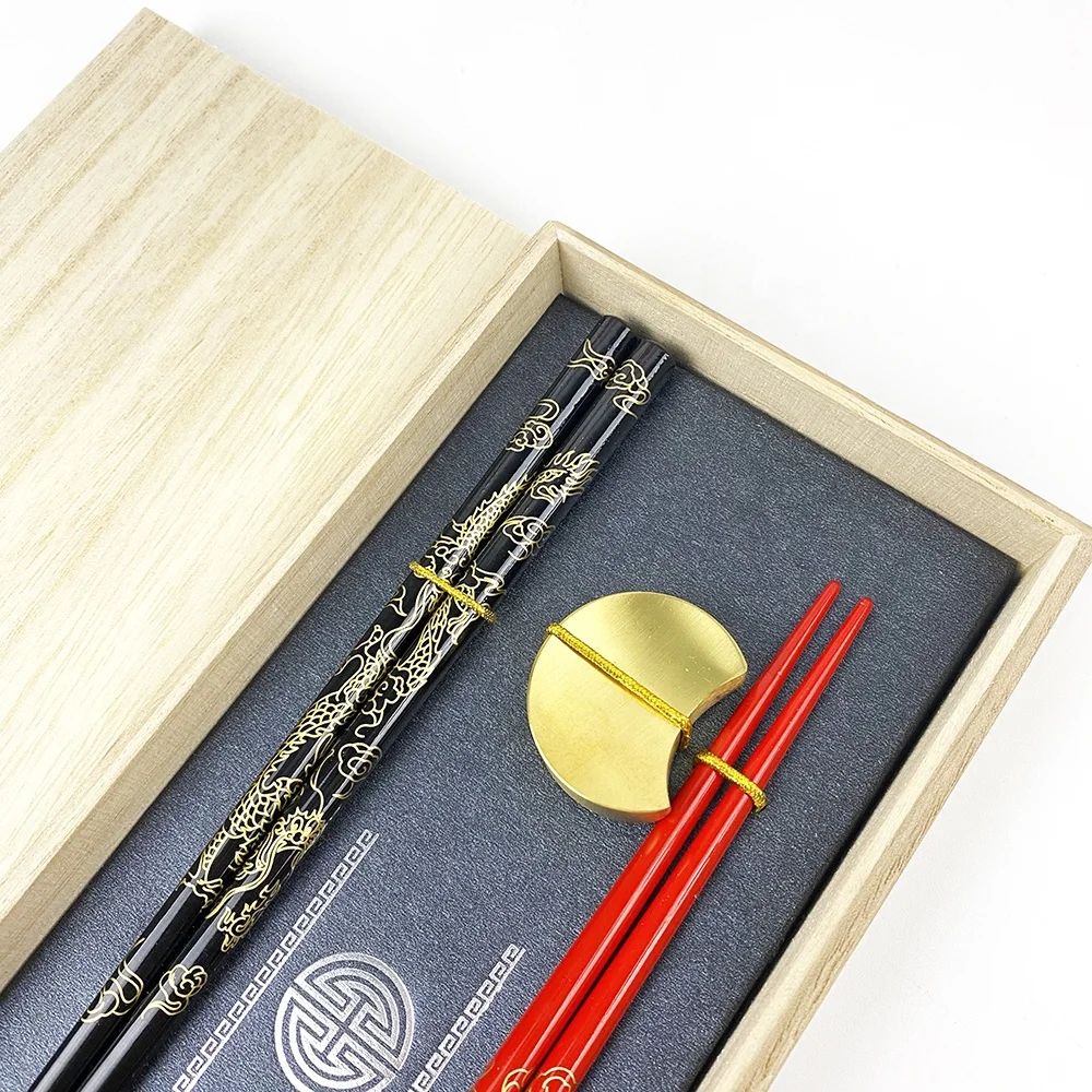 high-end golden dragon wood chopsticks with elegant golden moon stainless steel holders for restaurant