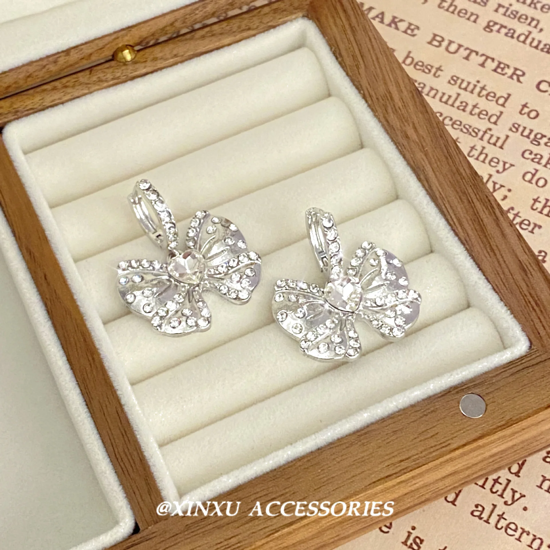 Bow ear female 2024 new fashion summer niche design sense of advanced micro-diamond earrings sweet temperament