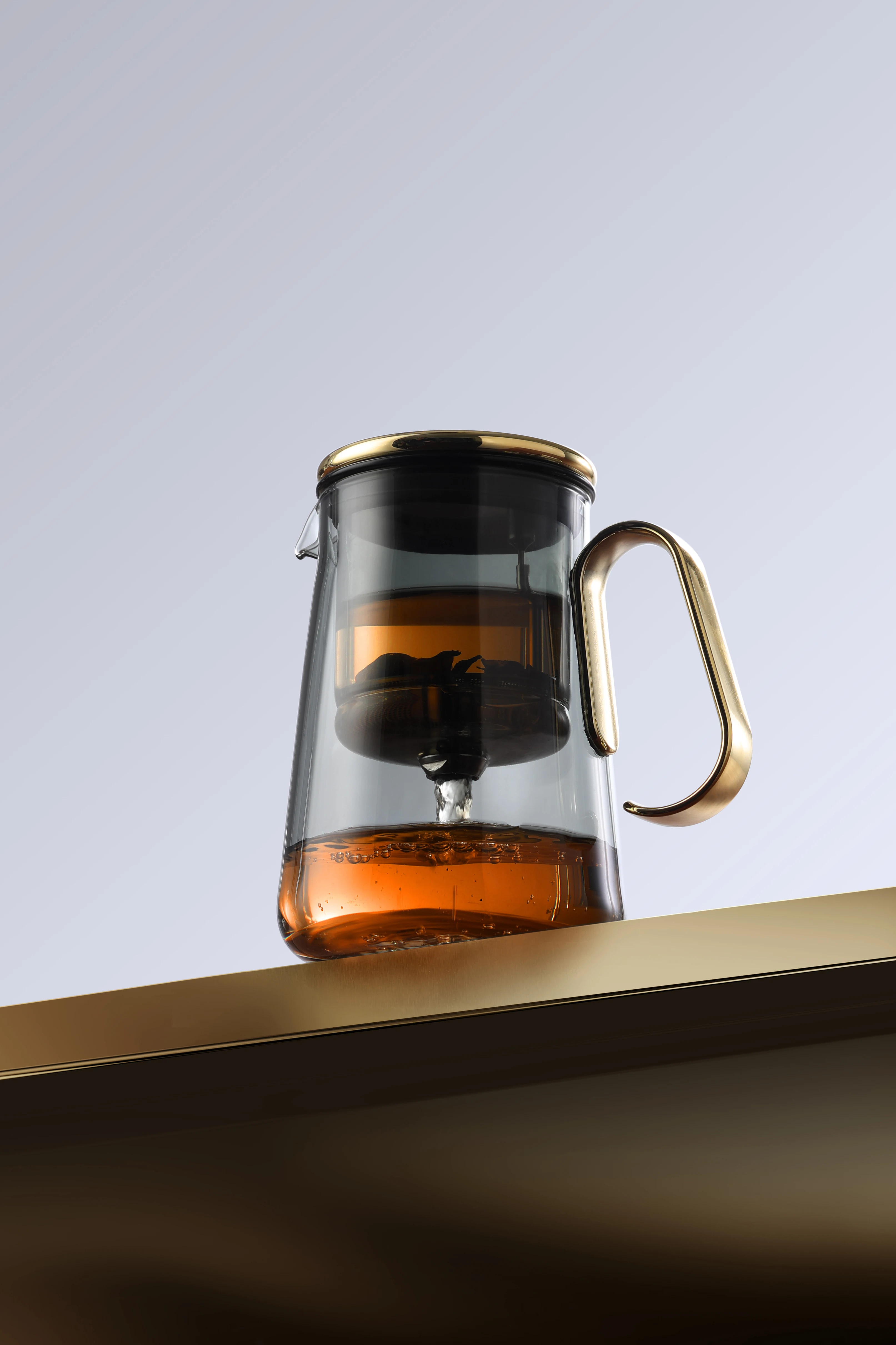 The New Large Capacity Custom 700ml Chinese Heat Resistant Glass Kettle Magnetic Rotating Tea Pot Set With Handle Filter