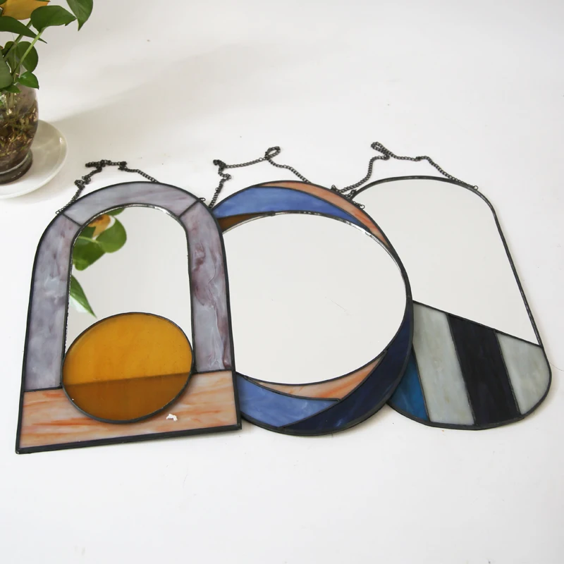 Vintage oval Blue orange and brown  inlad metal wall hanging mirror with chain