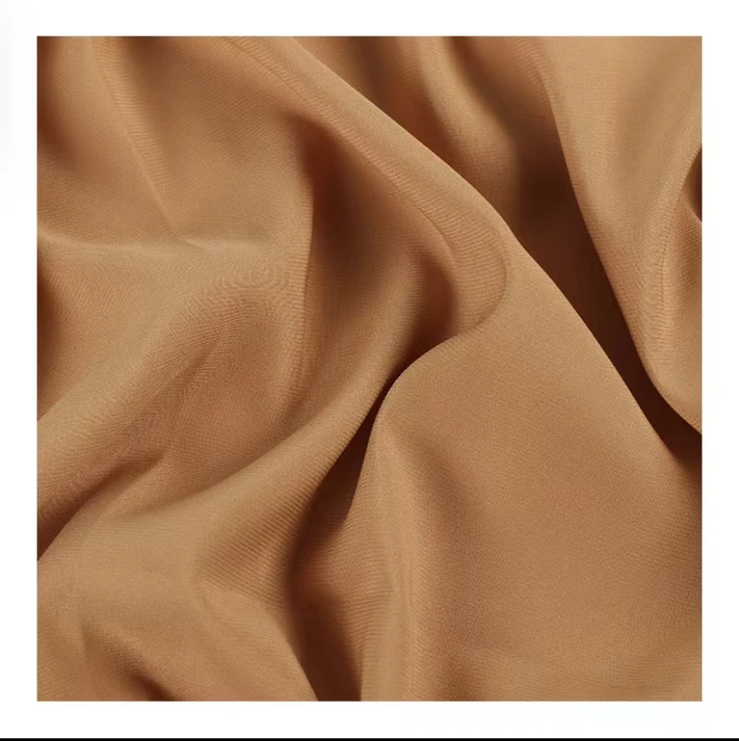 The fabric is made of 100% nylon, which is more windproof and suitable for making down jacket