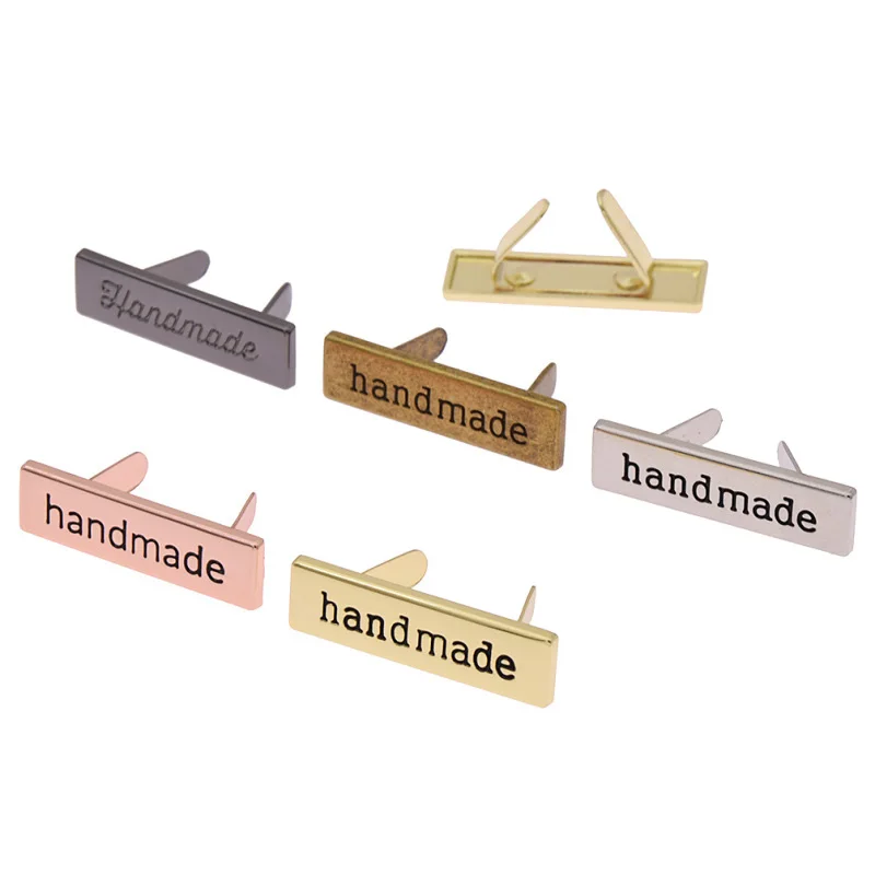 Wholesale Customization Logo Sustainable Washable Plating Garment Label Embossed Metal Label For Clothes