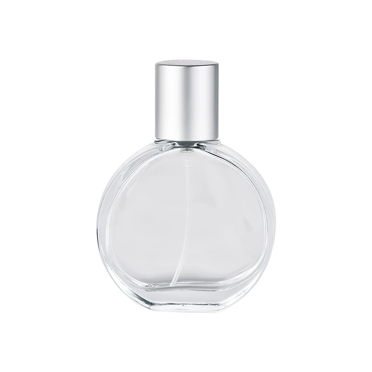 Custom logo 50ml 100ml carving metal shell empty fancy mist spray perfume bottles clear glass bottle with matte silver gold lid