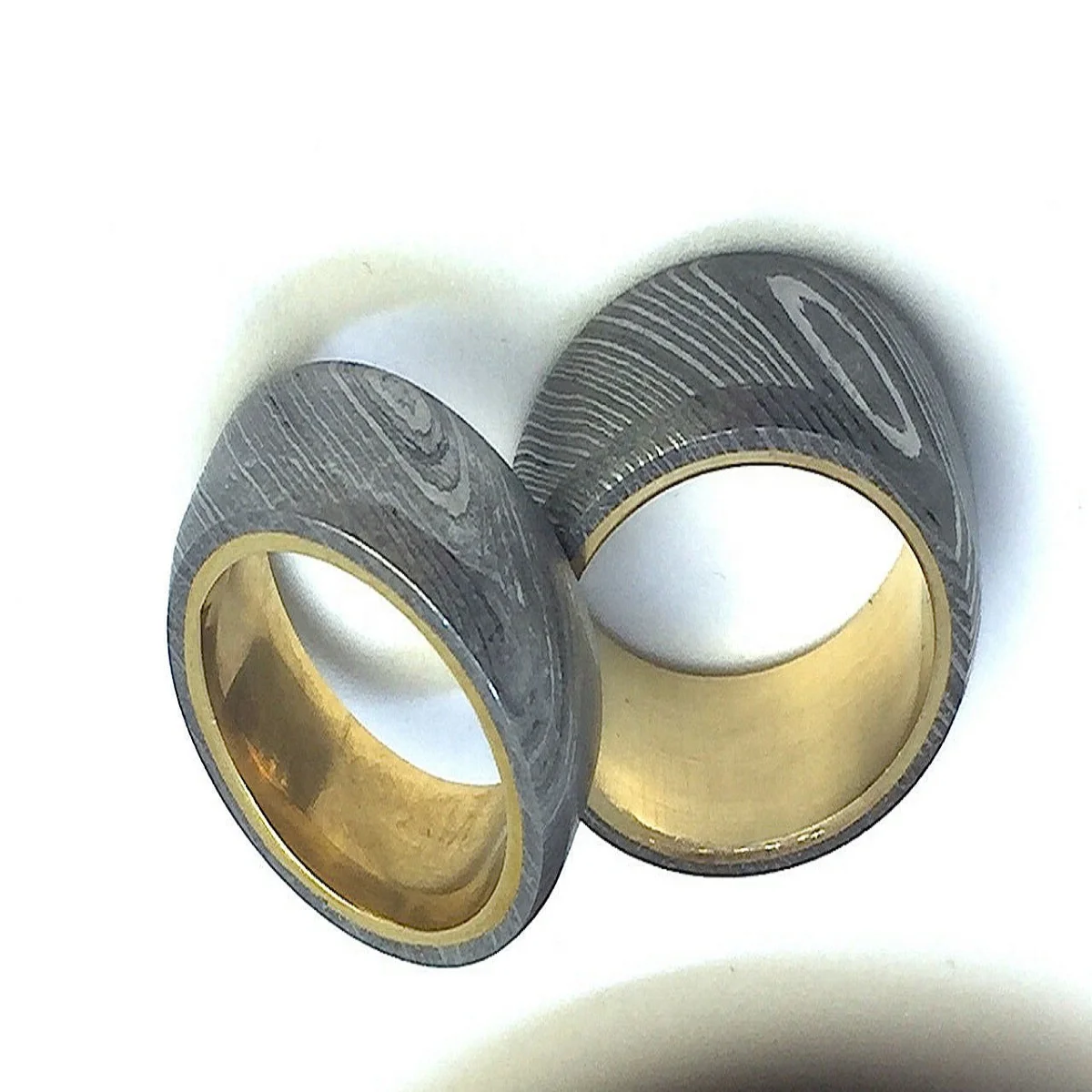 Damascus Steel Twist Pattern Ring With Anodized Titanium Interior brass Sleeve Custom Made
