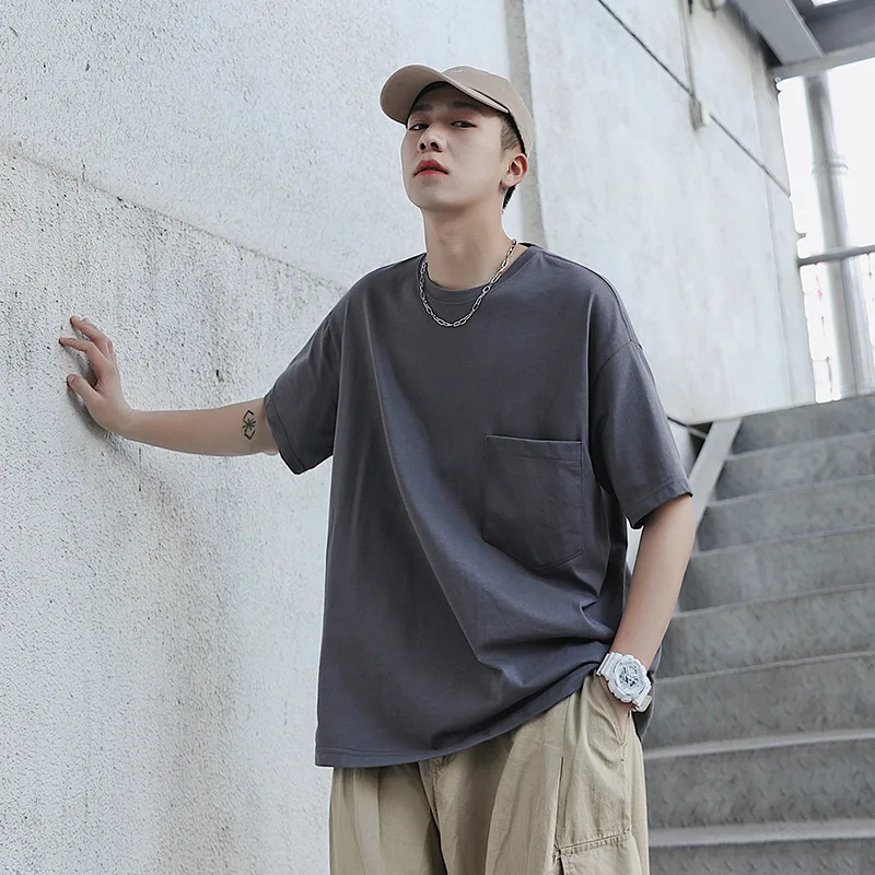 Wholesale cotton loose solid color youth men pocket decoration round neck t shirt short sleeved