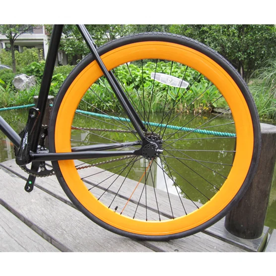 700C single speed with orange rims raiser bar colourful fixed gear bike