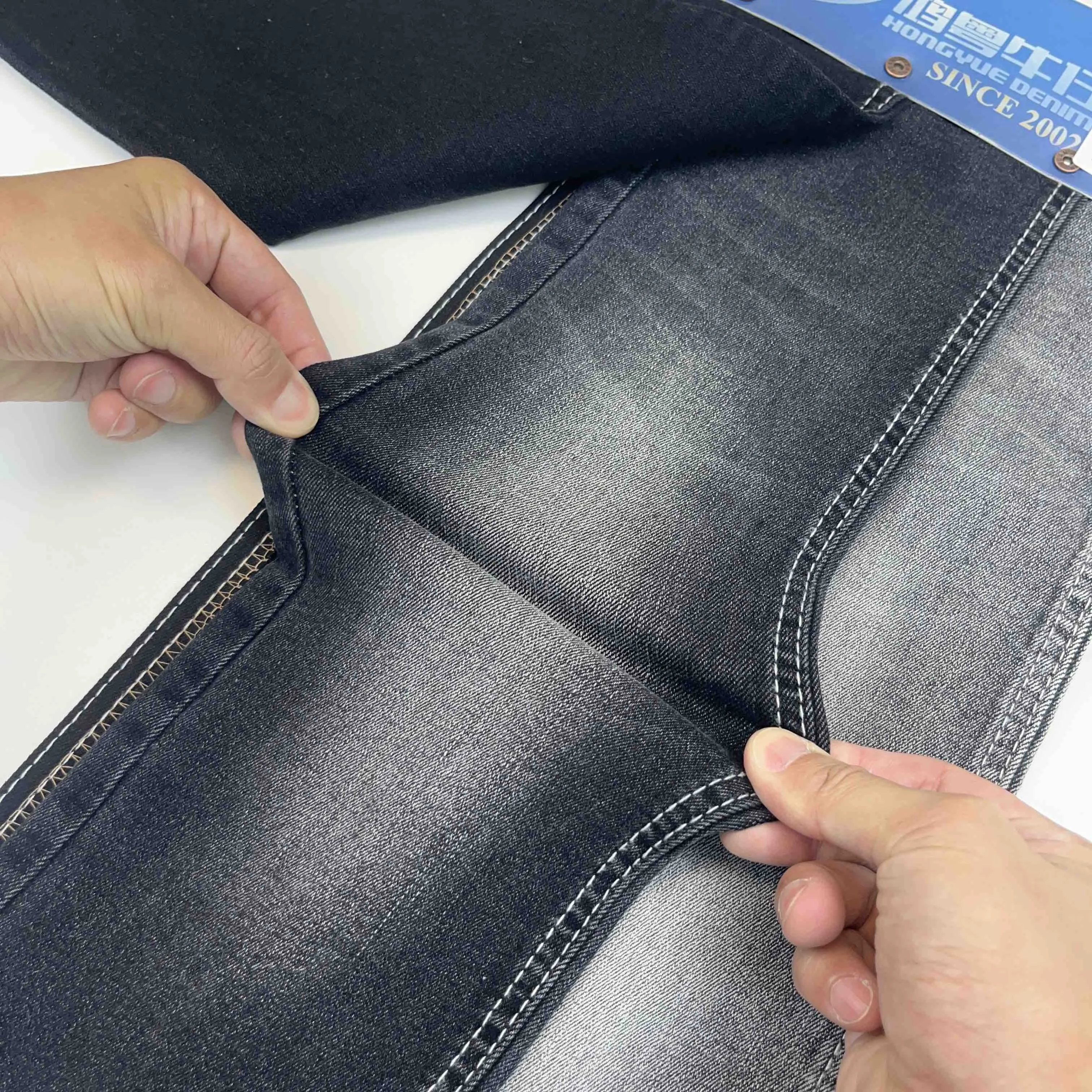 Soft Comfortable Twill Stretch Denim Jeans Fabric With Custom Design Slub Raw Denim Fabric Manufacturers In China