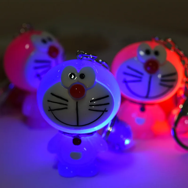 Creative cartoon resin with lamp doll cat key chain luminous doll pendant couple Accessories Wholesale