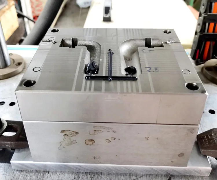 Low voltage injection molding of antenna circuit board PA adhesive
