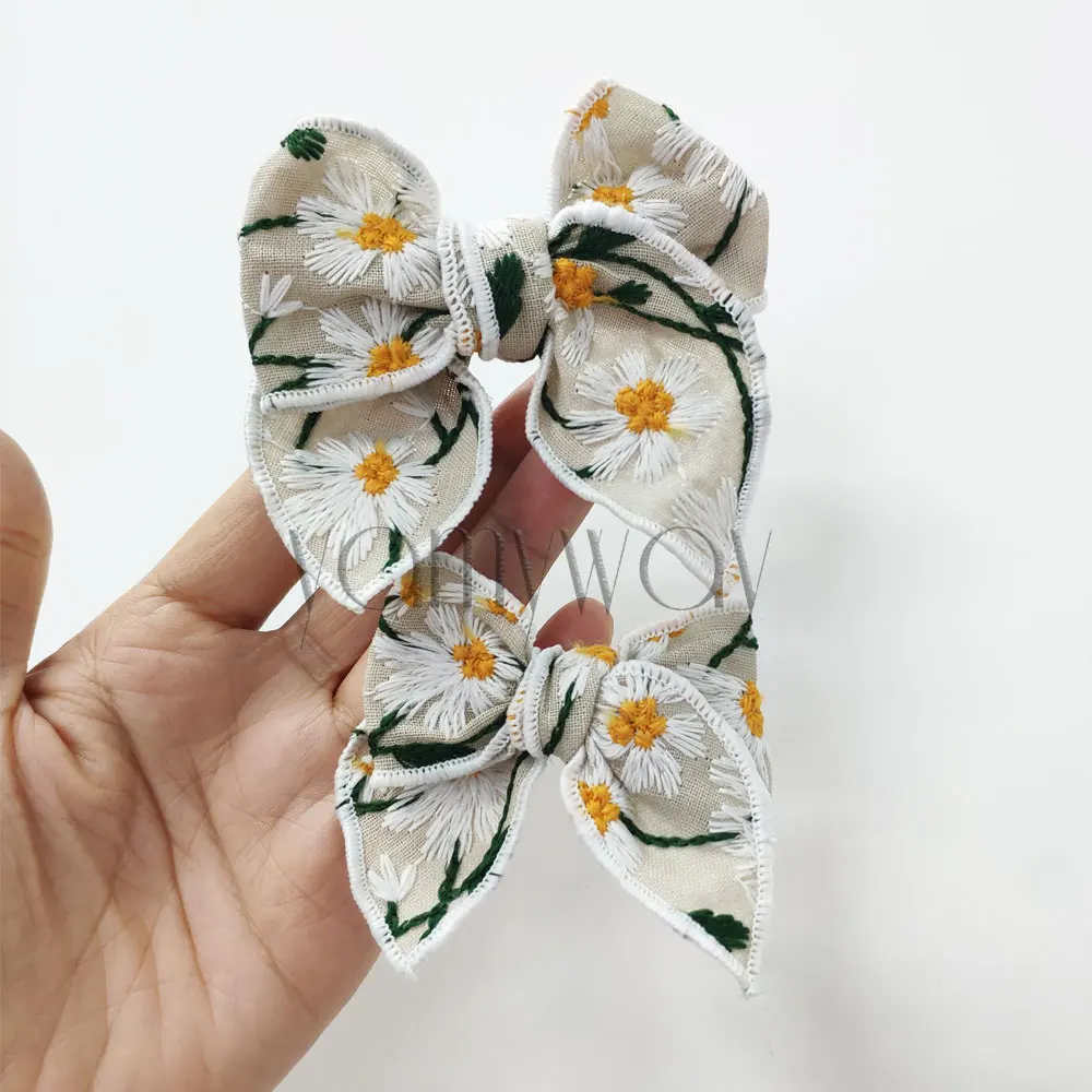 spring and summer linen daisy hemmed edge hair bow with custom size and shape for girls