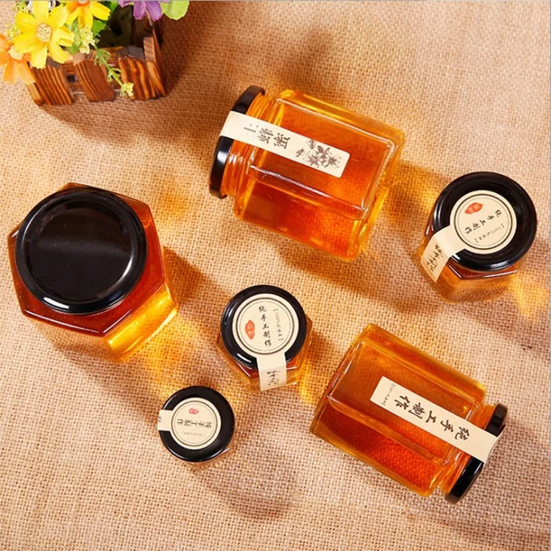 Wholesale 100ml 180ml 280ml 500ml 730ml Custom Round Empty Storage Hexagon Honey Jar Glass With Lid