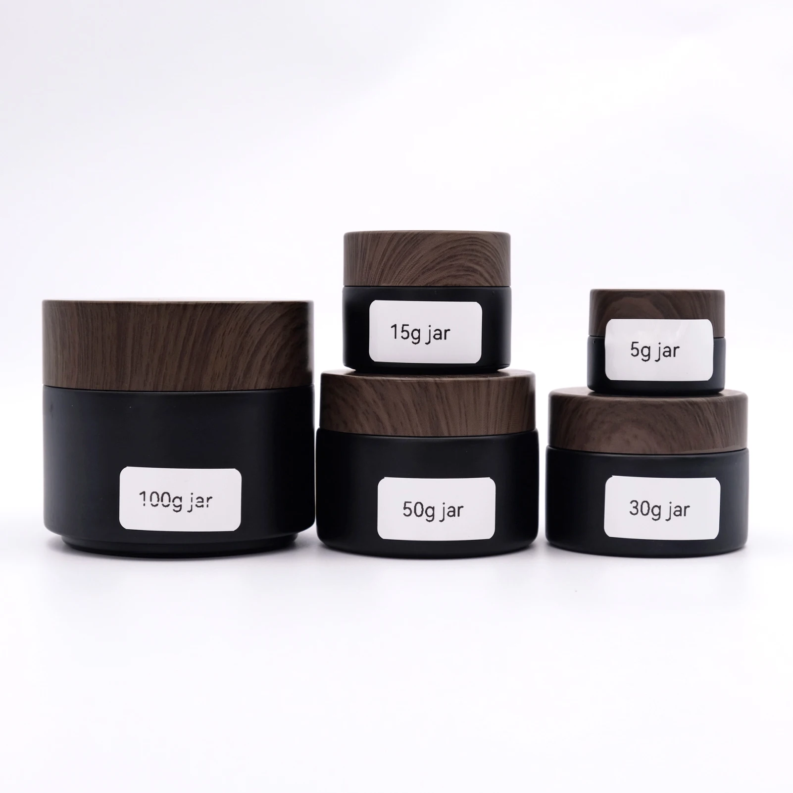 Wholesale 5g 15g 30g Cream Jar 50g 100g Matte Black Glass Jar with Wood Grain Cover