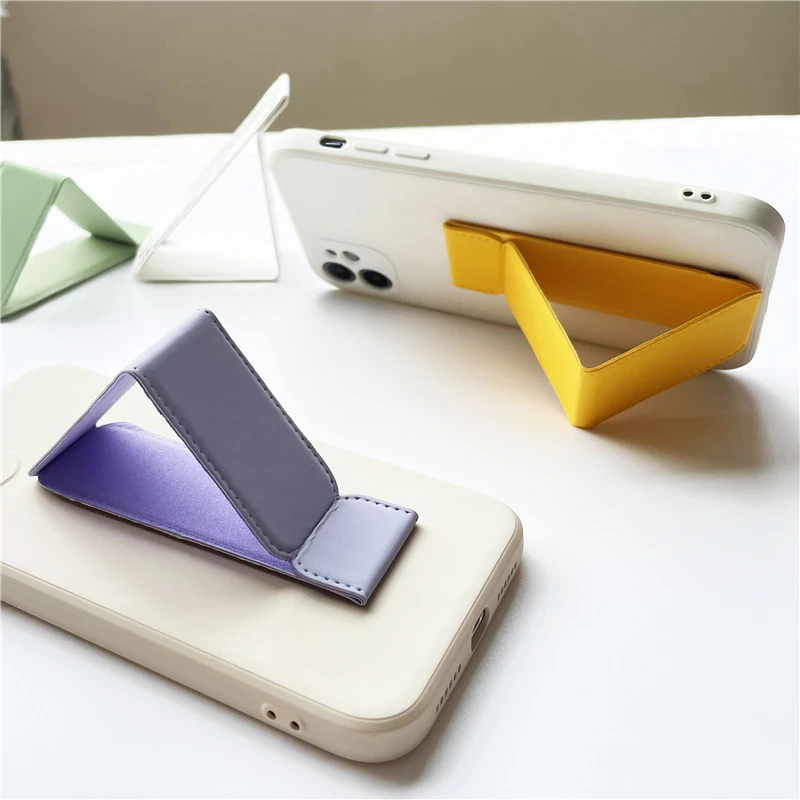 Factory wholesale mobile phone shell bracket magnetic suction leather folding bracket magnetic adsorption magnet PU bracket