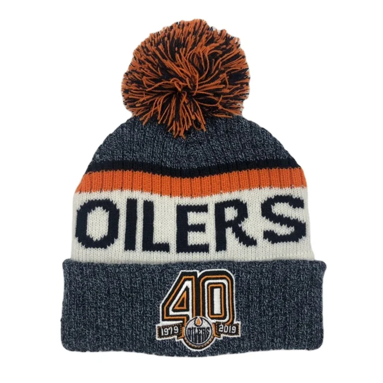 Hot Sale Acrylic Cuff Jacquard Knitted Winter Hat Beanie Hat Embroidered Pom Pom Ball Beanie Cap With Custom Leather Badge Logo