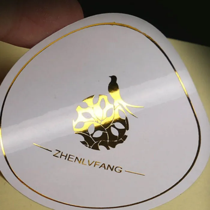 
Custom Printing Transparent Roll Logo Labels Clear Waterproof Gold Foil Vinyl Self Adhesive Labels 