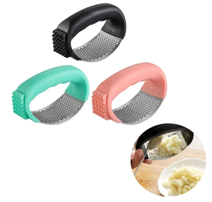 Hot selling kitchenware set stainless steel manual garlic press garlic crusher curved with plastic handle