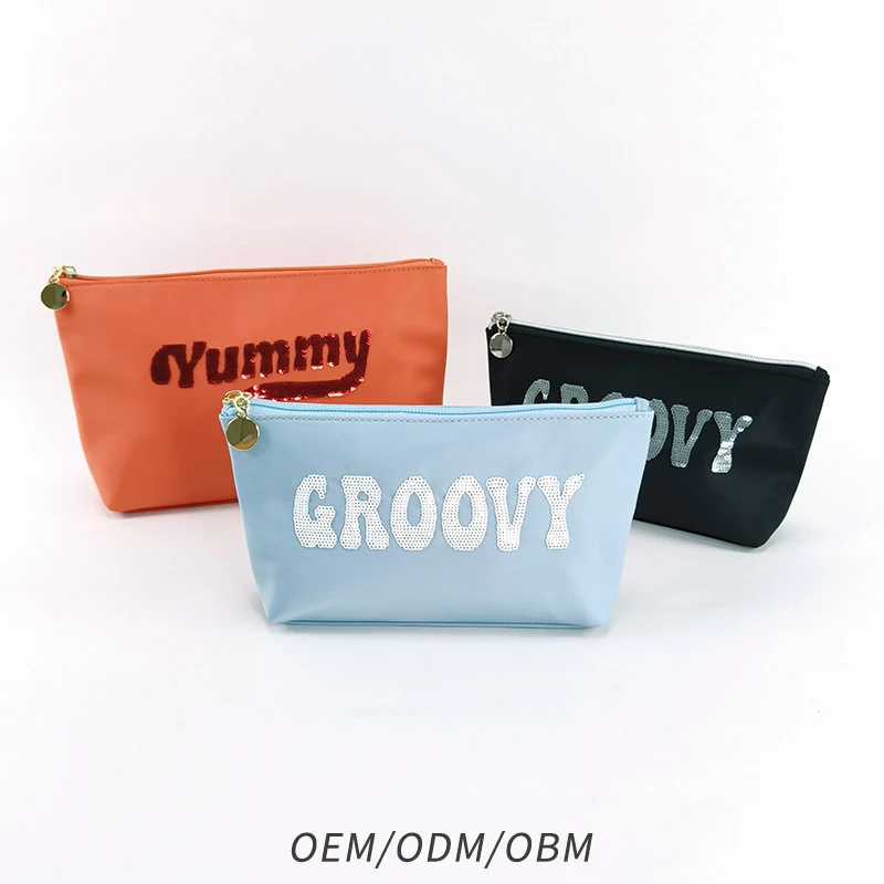 Durable leisure style Custom polyester black blue beauty makeup bag sequins embroidery text logo easy travel cosmetic bag