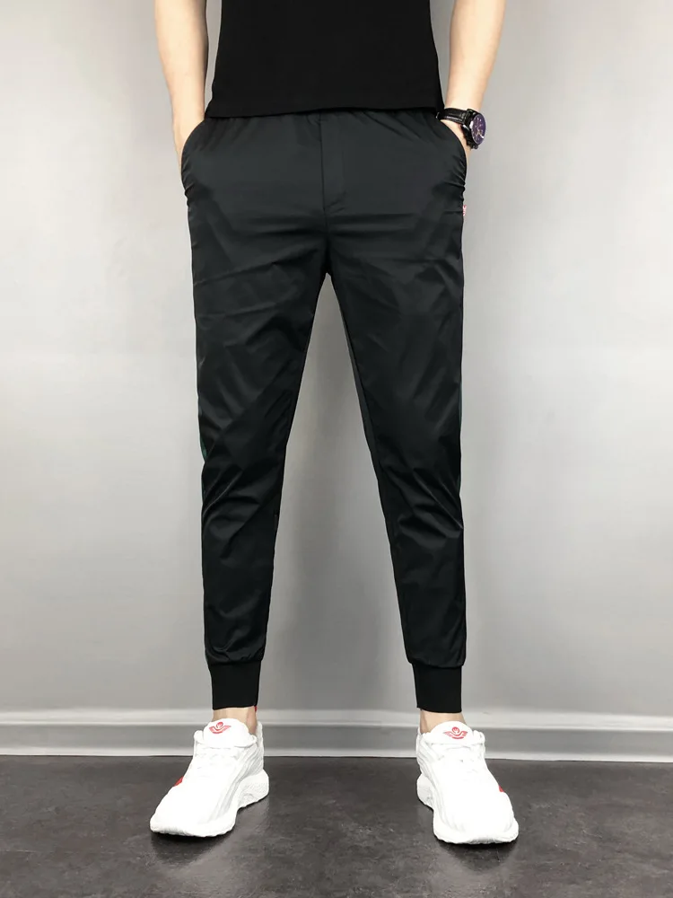 FanLi Men Loose Fit Reflective Printing Drawstring Windbreaker Mesh Lined Sport Track Pants