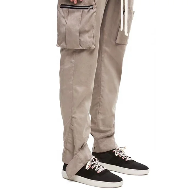 
Low moq street multi zipper pockets pencil pants solid color elastic drawstring jogger pants popular casual cargo pants stock 