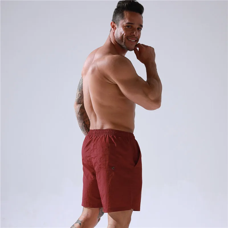 wholesale men pants summer sports shorts loose fit quick dry polyester board shorts male swim trunks beach shorts with pockets