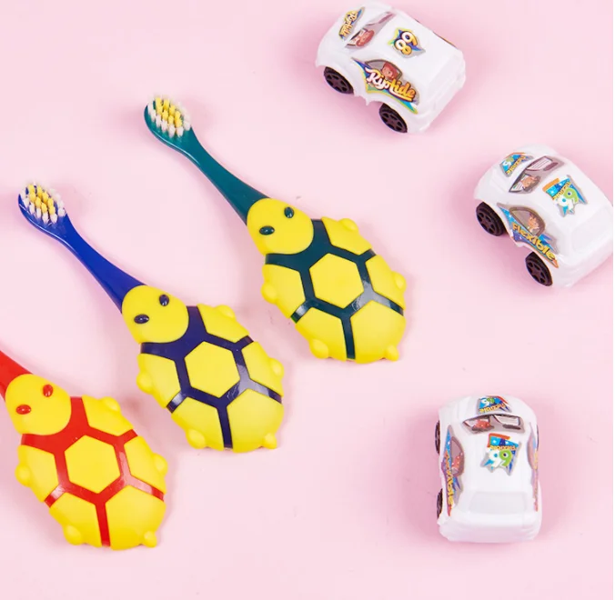 OEM Cute turtle design cartoon kids toothbrush with free car toy gift 600 million+ times soft bristles grinding