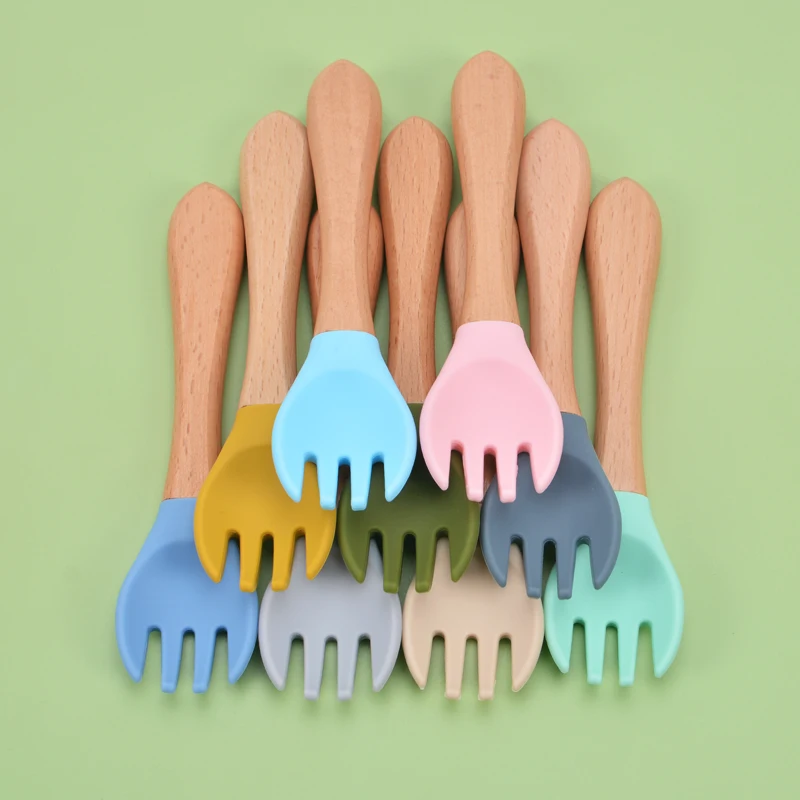 Top Selling Baby Soft Silicone Feeding Forks Nature Materials Infant Silicone Tips Baby Fork With Wooden Handle