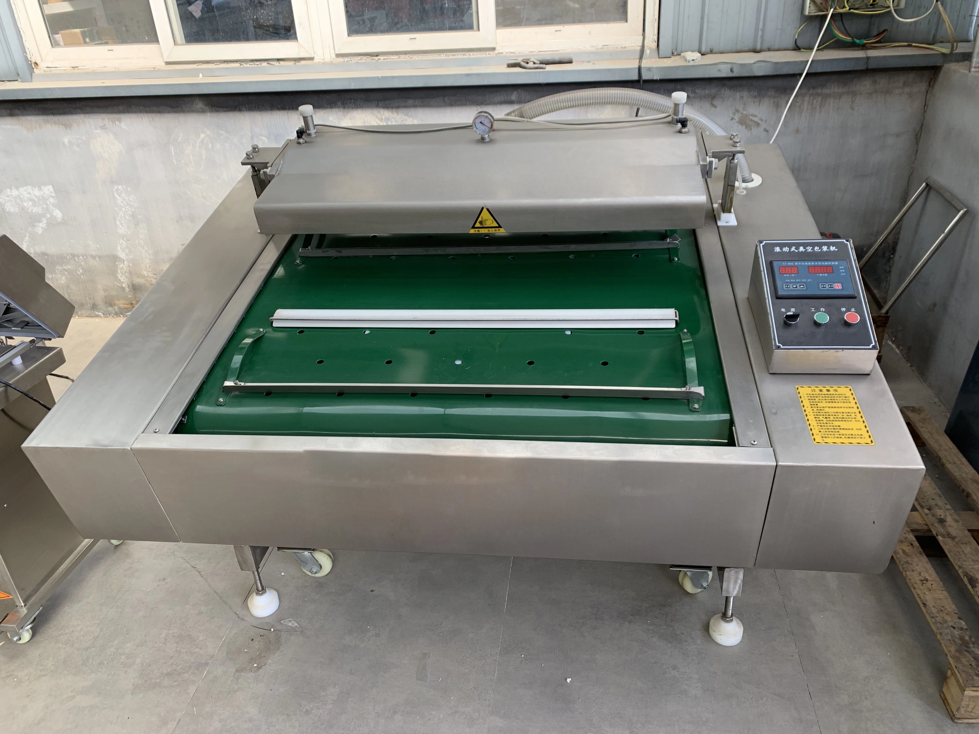 DZ-1000 automatic packing food rolling belt type rolling vacuum packaging machine