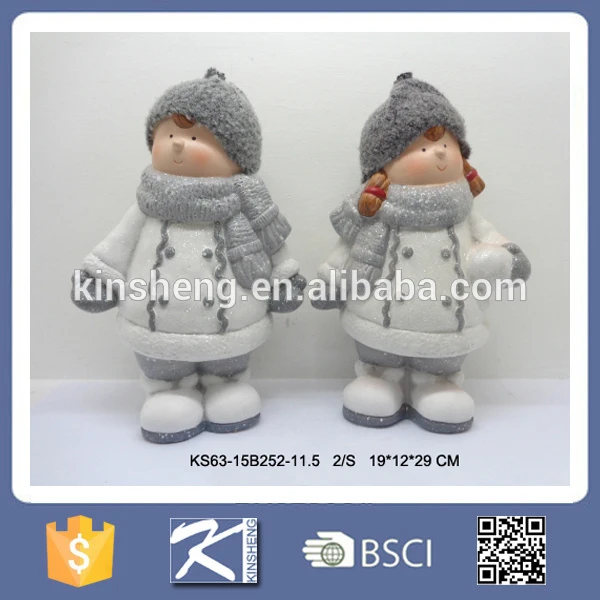 Christmas boy and girl ceramic figurines for sale