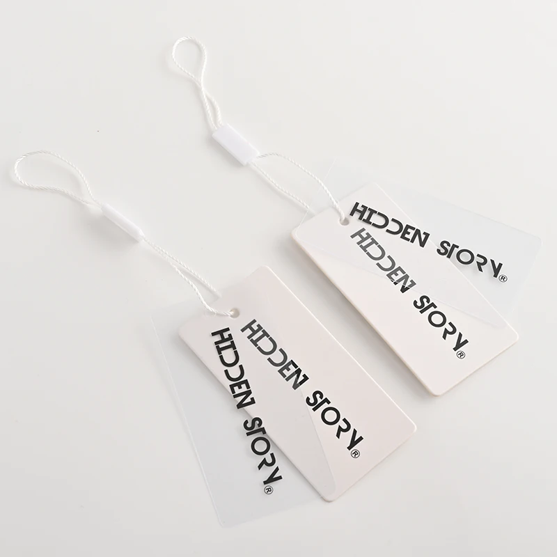 Custom Luxury 800gsm Thick Clothing Hang Tag Cardboard Garment Tags Transparent Frosted PVC Hang Tags With the Plastic Lock Rope