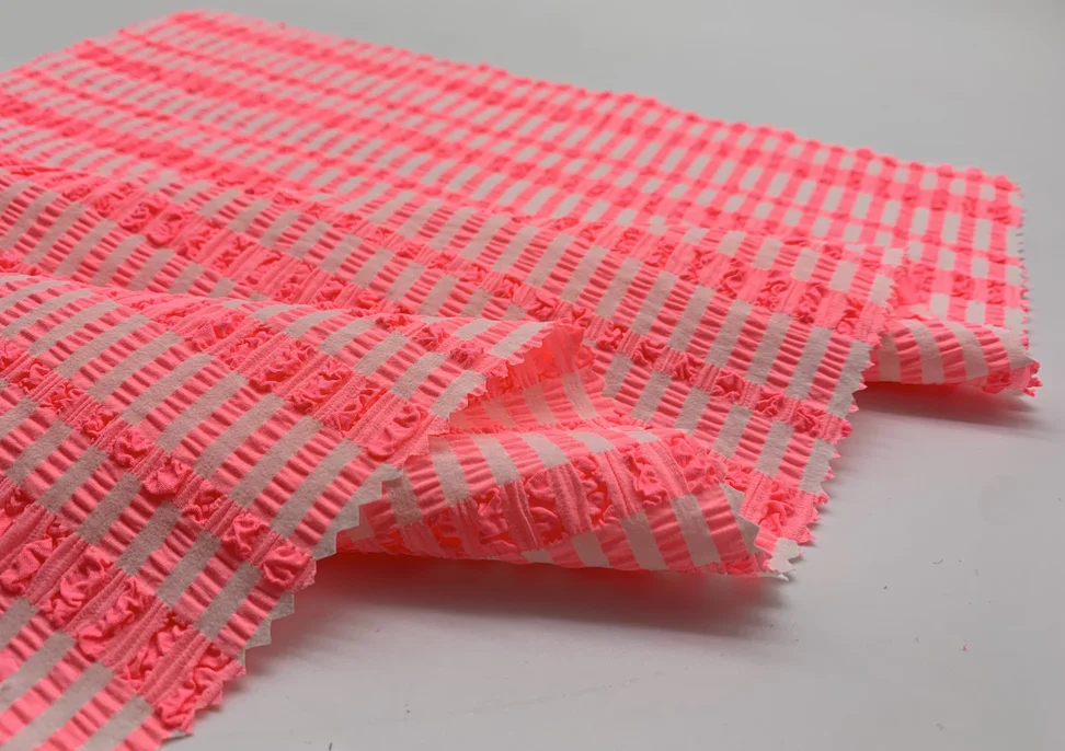 Hot selling customized color 4 way stretch woven Jacquard seersucker swimwear fabric