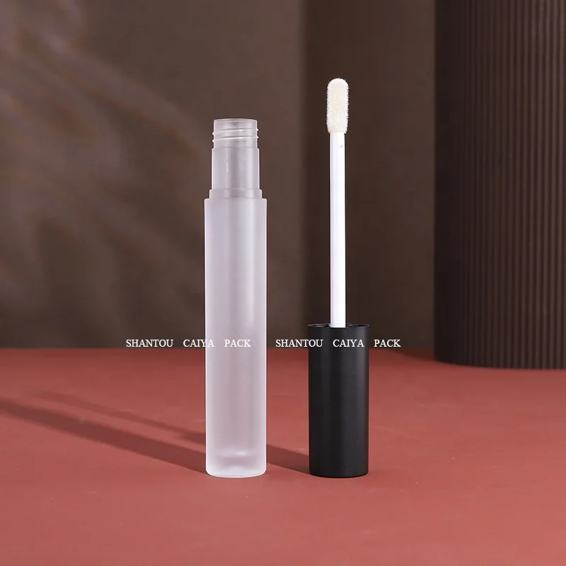 Shantou cosmetic packaging manufacturer wholesale 3ml long neck empty frost black silver round lip gloss balm tube heart brush