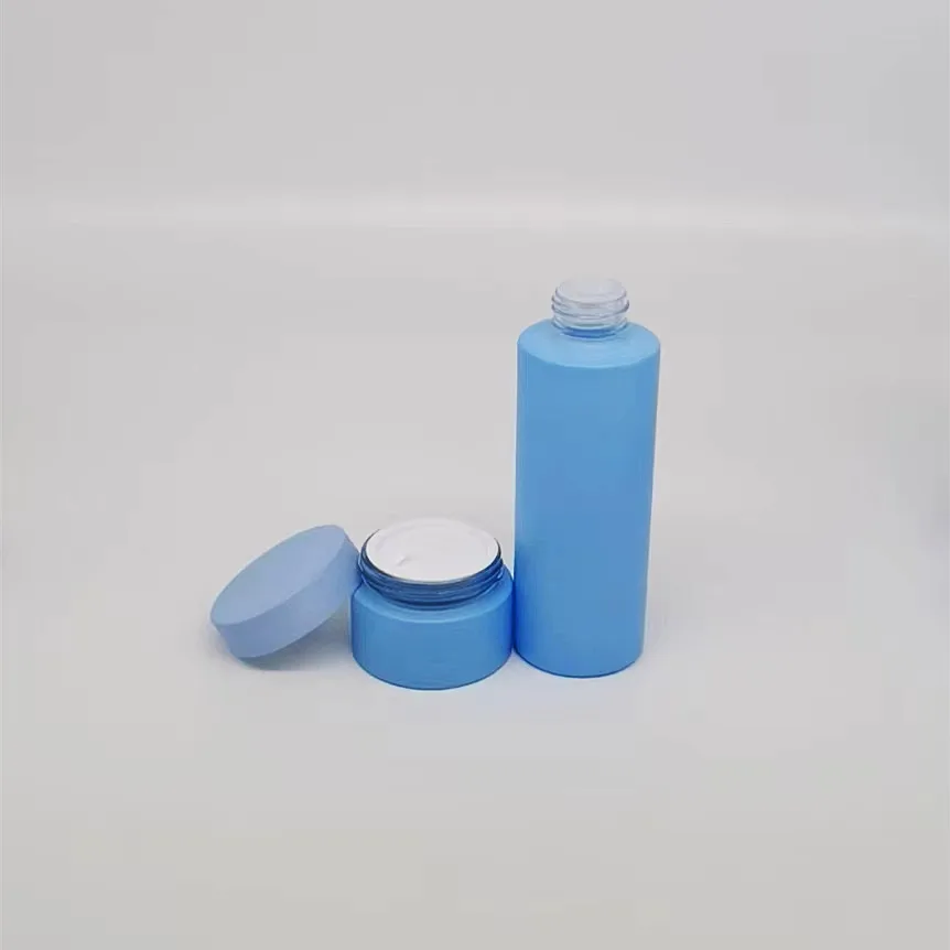 Low MOQ empty 30ml 1oz glass blue frosted cylinder glass essential oil dripping bottle rubber stopper