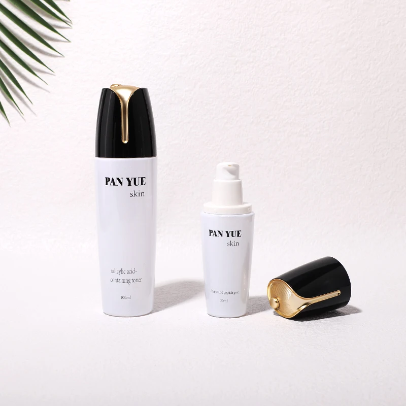 The latest lotus shaped empty glass bottle set with plastic plating lid for cosmetics skincare packaging wholesales