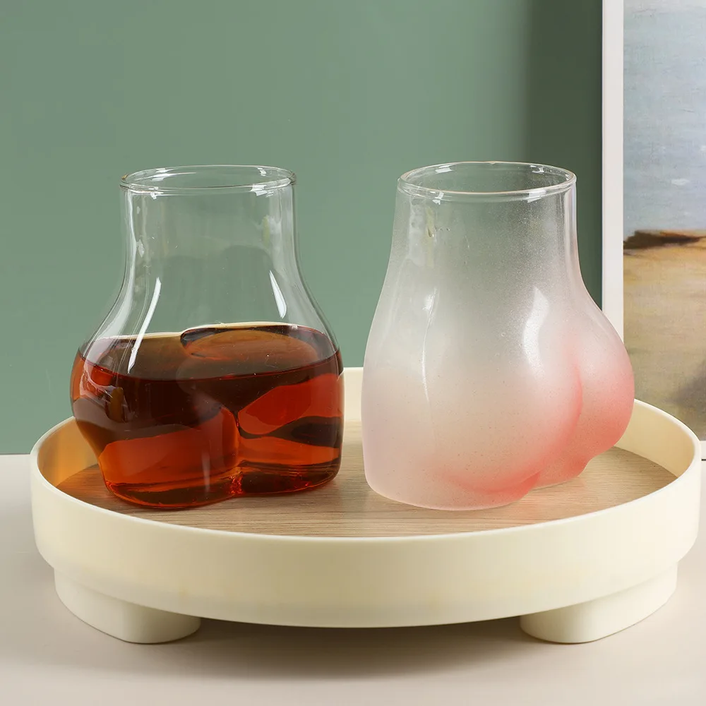 YML factory wholesale Creative personality funny peach butt shape glass  bottle pink frosted butt cup ins coffee drink cup