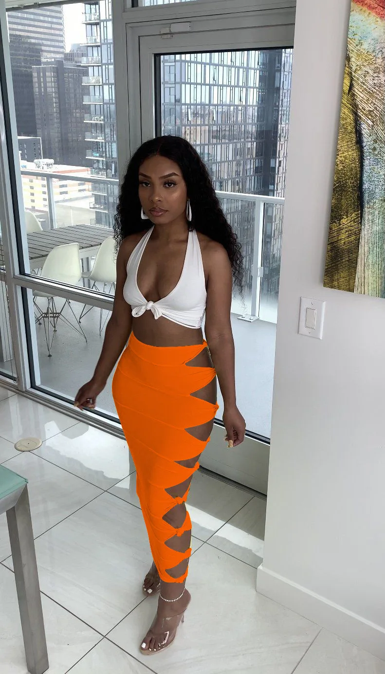 Street sexy solid color knotted and ripped stitching female long skirt