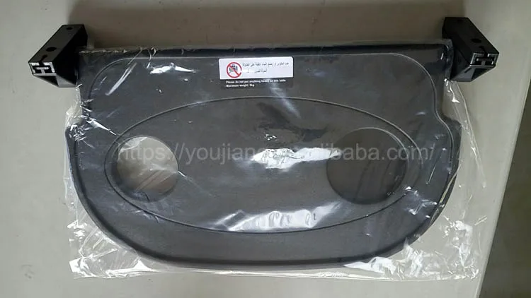 Folding plastic tray table for bus seat