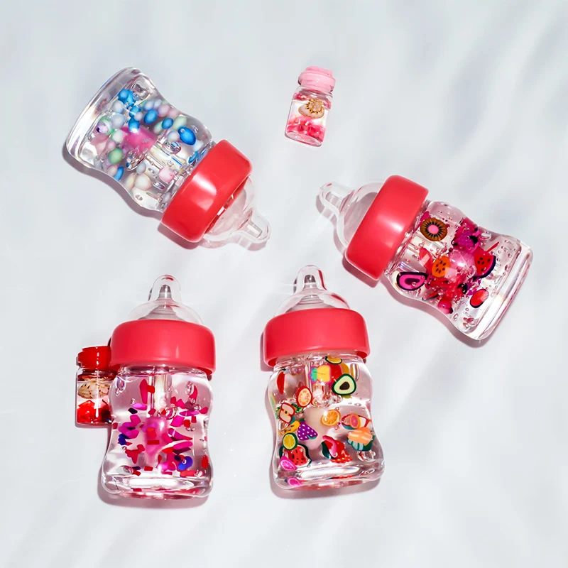 High quality Wholesale Hydrating Kids Cute Baby Bottle Candy Lip Gloss Tubes Lip Oil Plump Private Label Custom Vegan Lip Gloss