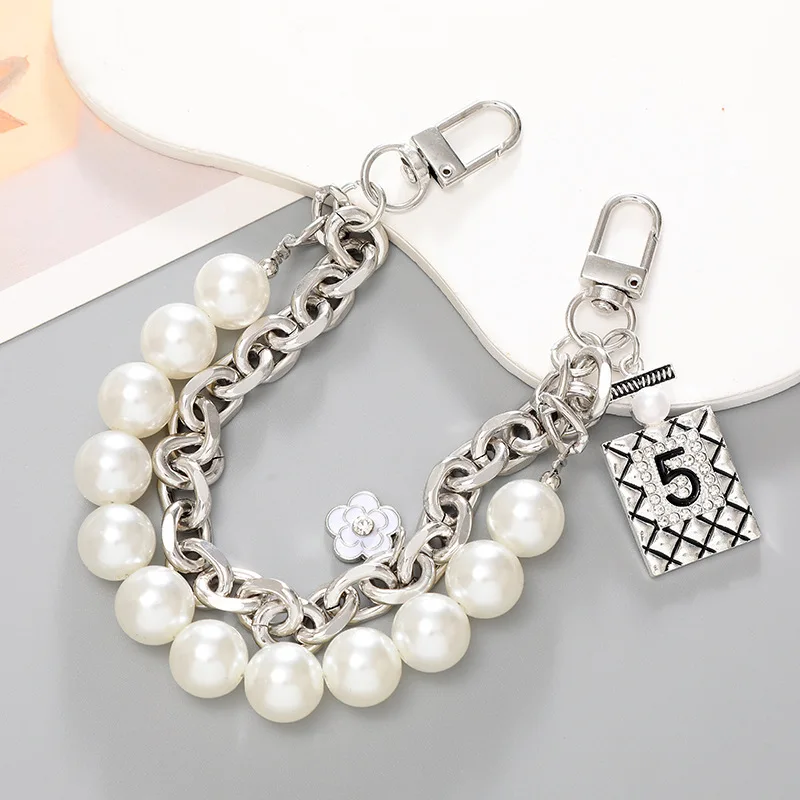 2024 Chain Link Fence Machine Gold Cuban Link  Gold Chain Plush Key  Waist   Pearl Handle Bags Chains Factory Offer