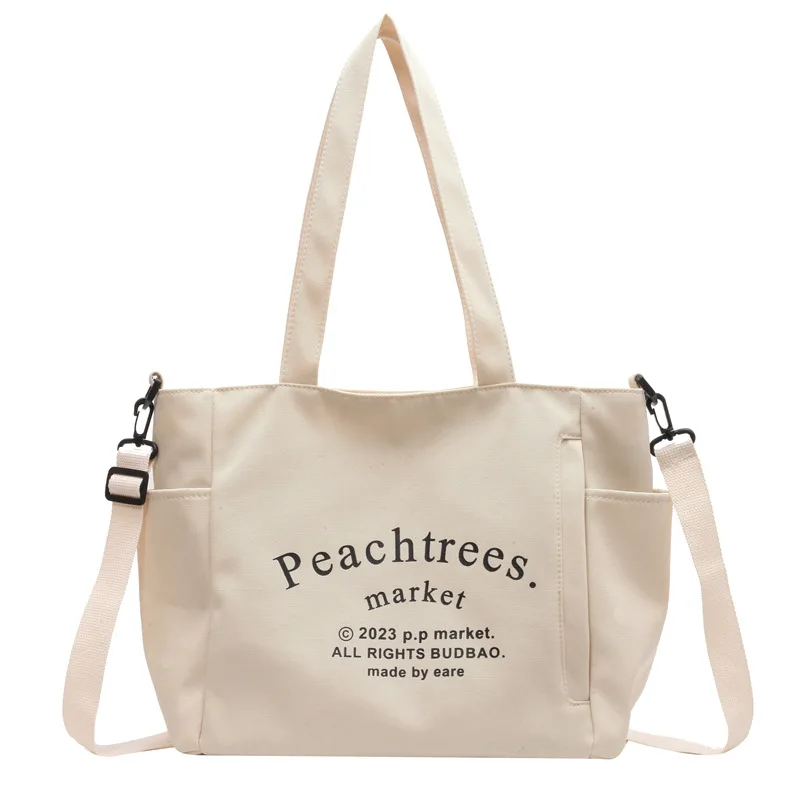 Student class canvas bag Female 2023 new fashion letter Tote commuter large capacity single shoulder crossbody bag