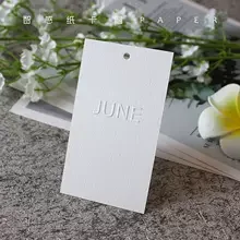 Customized 600g texture cotton paper luxury  labels logo embossed hang tags for cloths