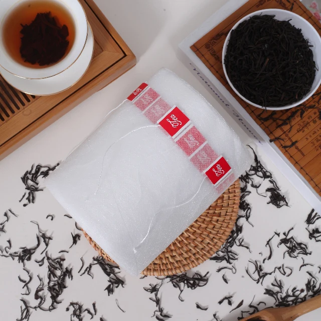 Bio-based Plastic-Free Corn Fiber Non Woven PLA Tea Packaging Pyramid Tea Bag Material For Wholesale