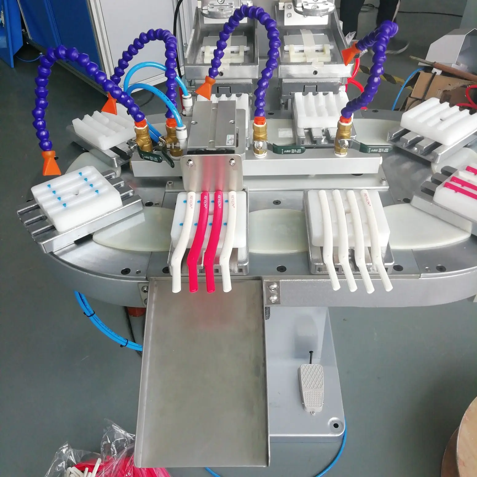 Two color pad printing machine with conveyor