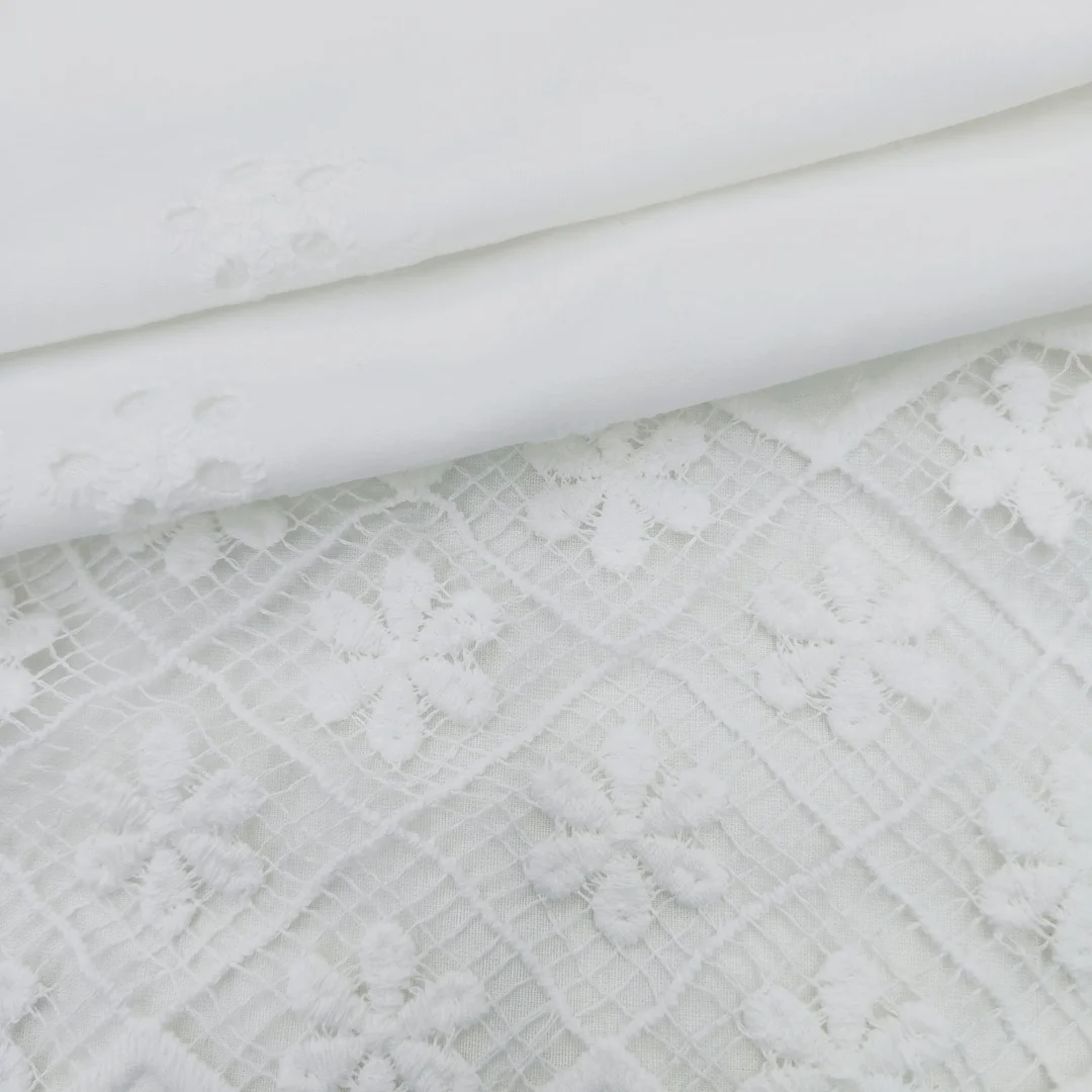 Stunning White Punched Design  fabric Adding a Splash of Color customized pure cotton  embroidery fabric for Tops