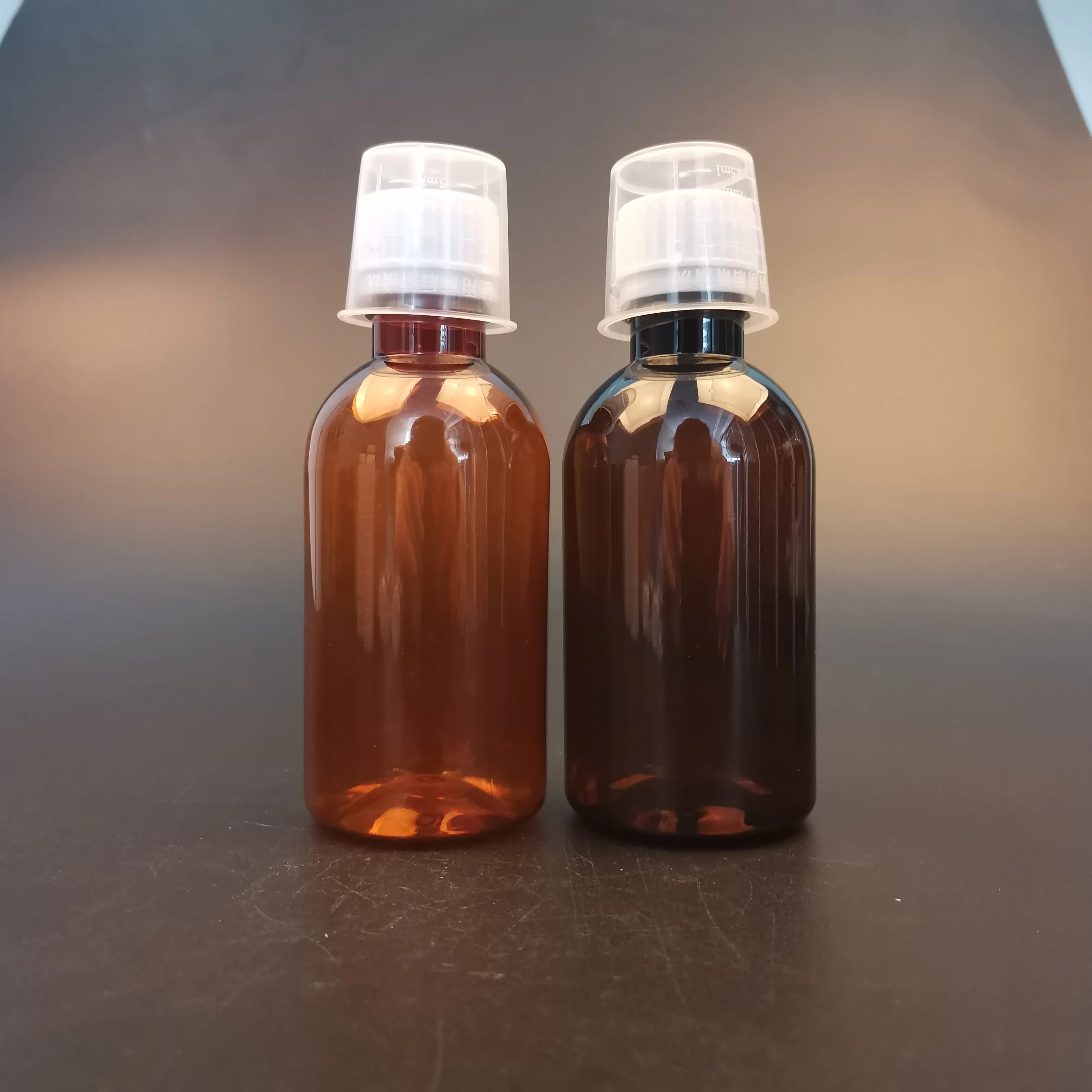 Пустая янтарная бутылка сиропа от кашля с пластиковой крышкой 100 мл 150 180