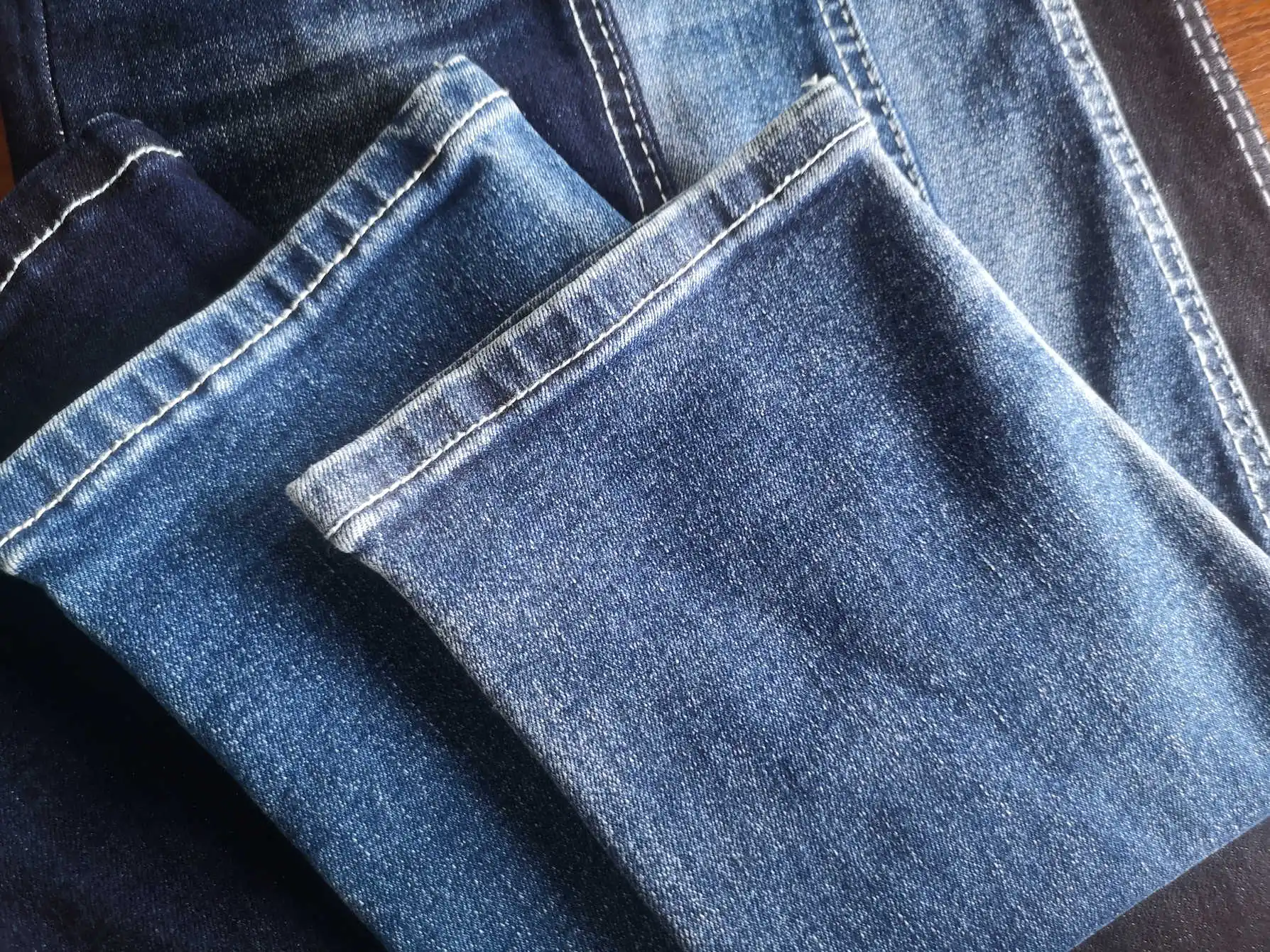 2549 Soft OE Foshan denim manufacturer raw material bull woven twill high stretch denim fabric for shiny jeans