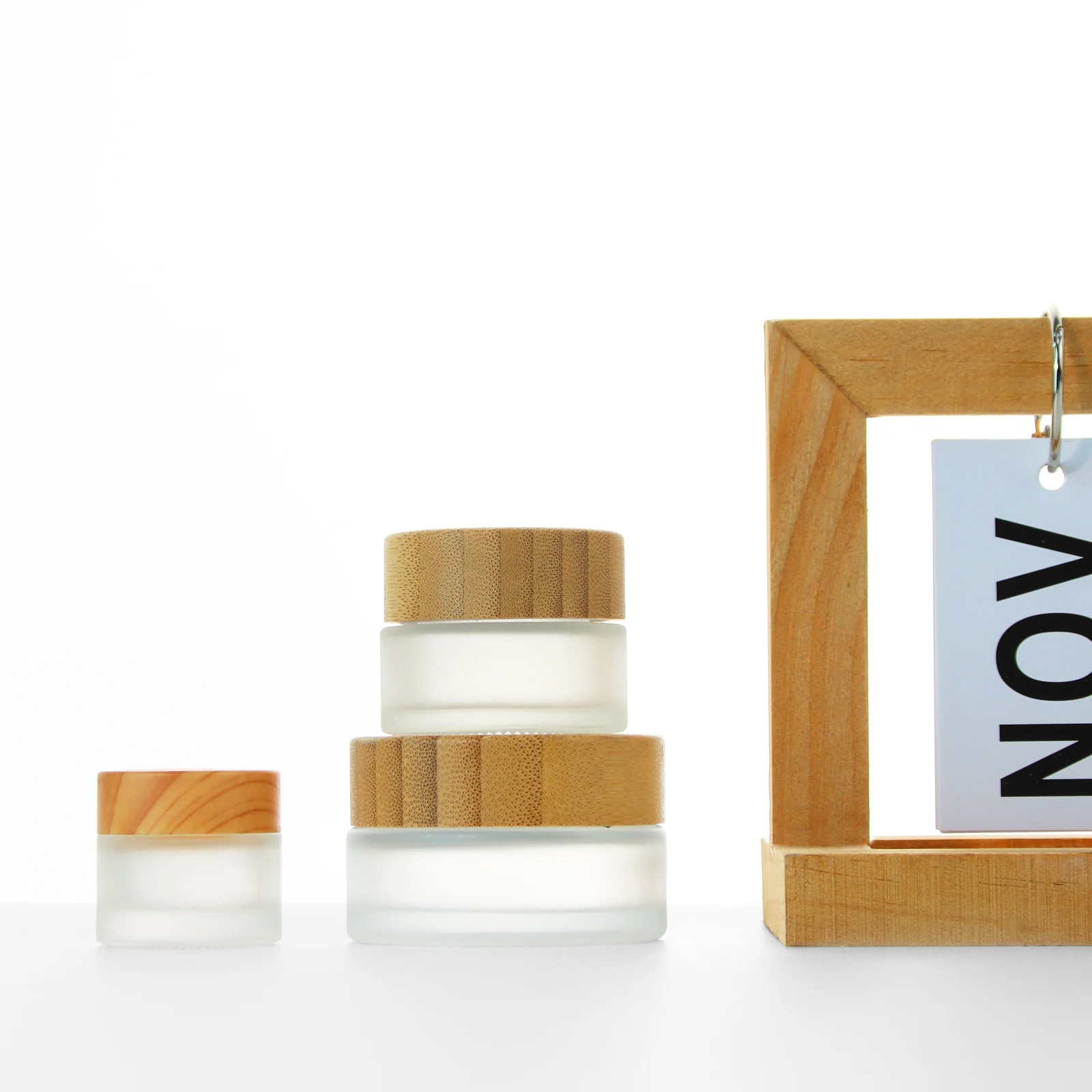 Wholesale clear frosted 30g 50g 100g  facial cream jar with bamboo cap high quality glass jar for cream