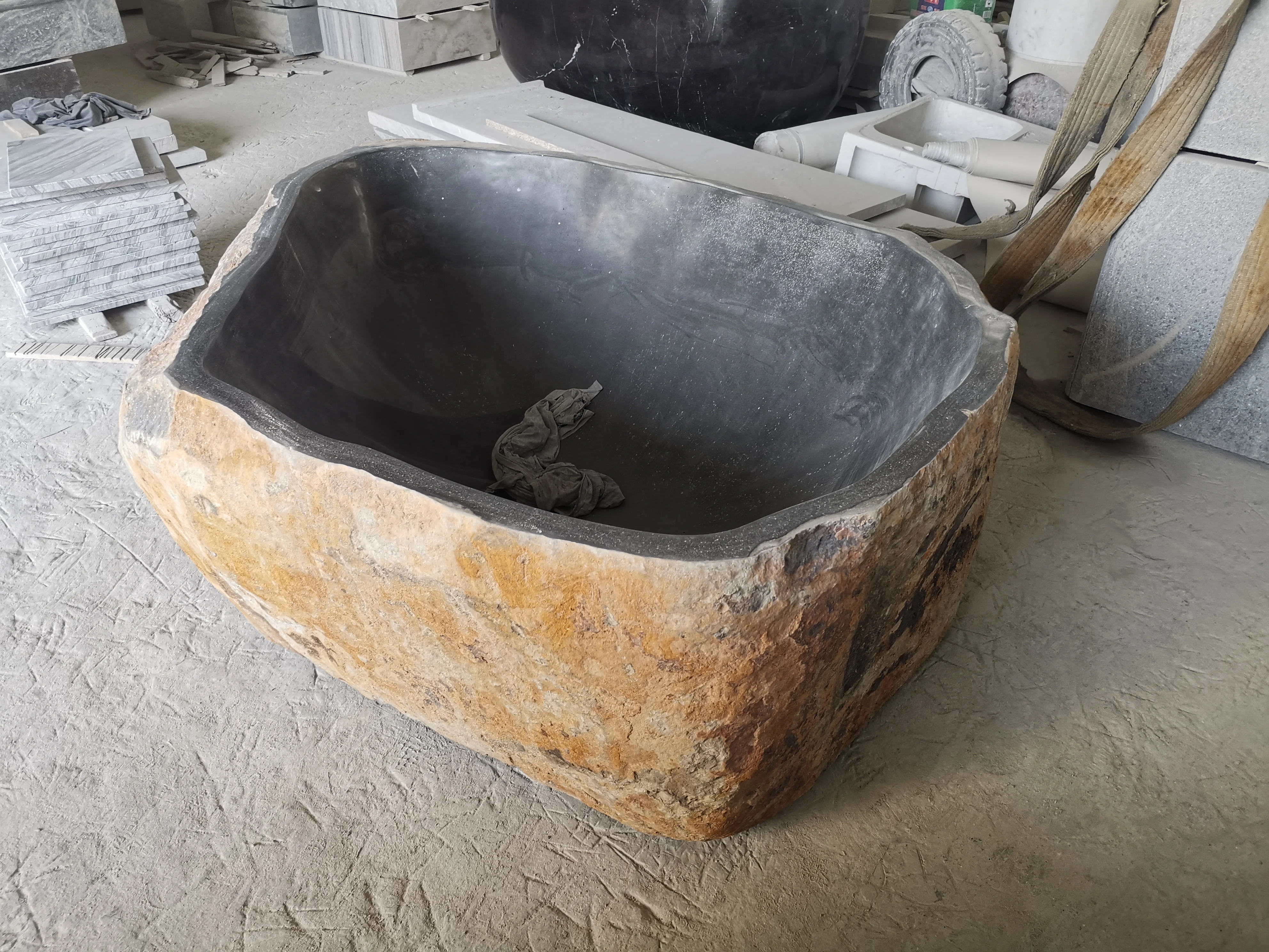 Free standing natural river stone bathtub