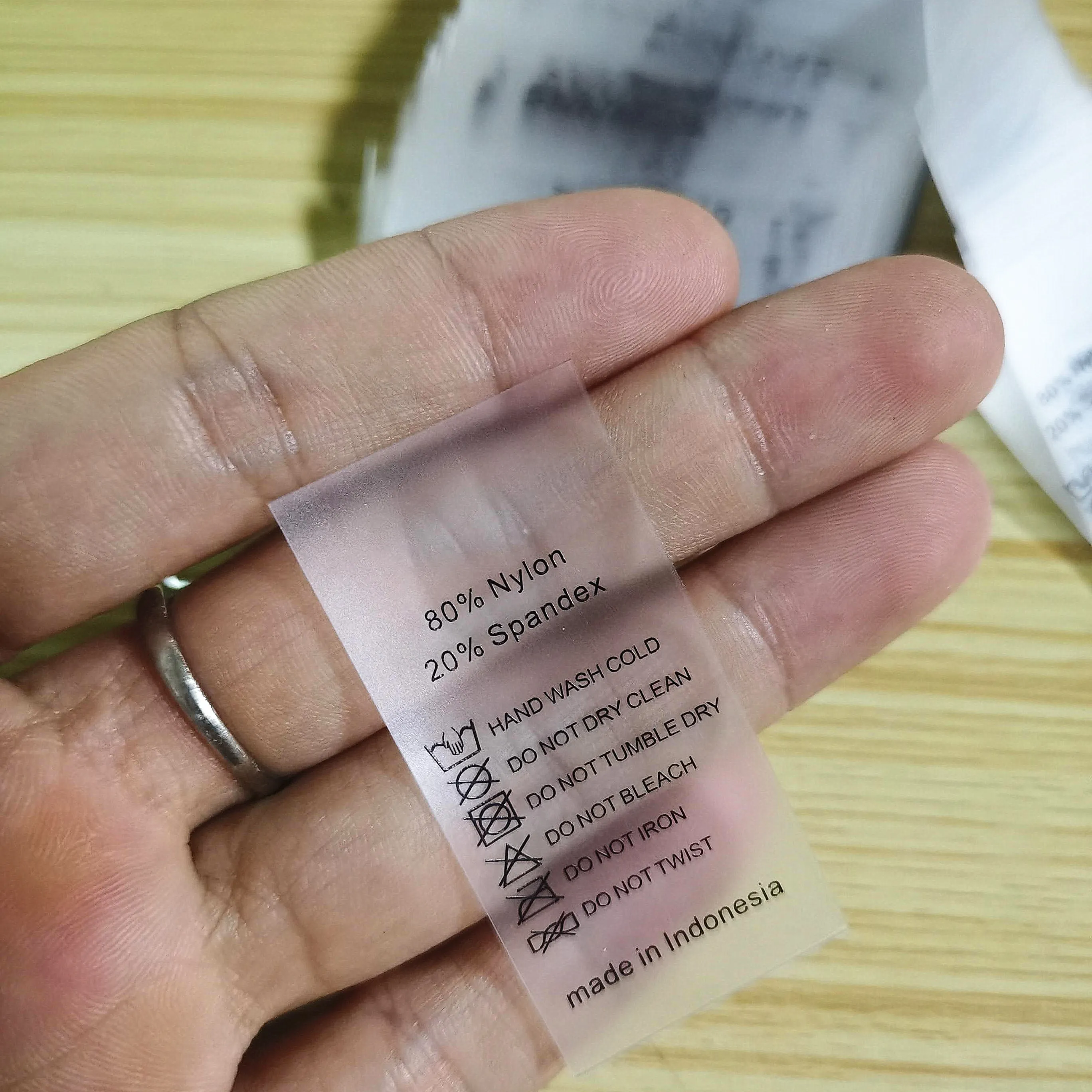 
Garment underwear size custom printed clear TPU sewn tag with logo and care symbol 